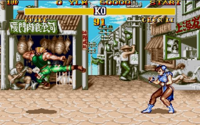 Guile fait un coup de pied retourné en direction de Chun-Li dans Street Fighter II' 