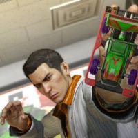 Yakuza 0 Kazuma joue avec une voiture miniature dans la main