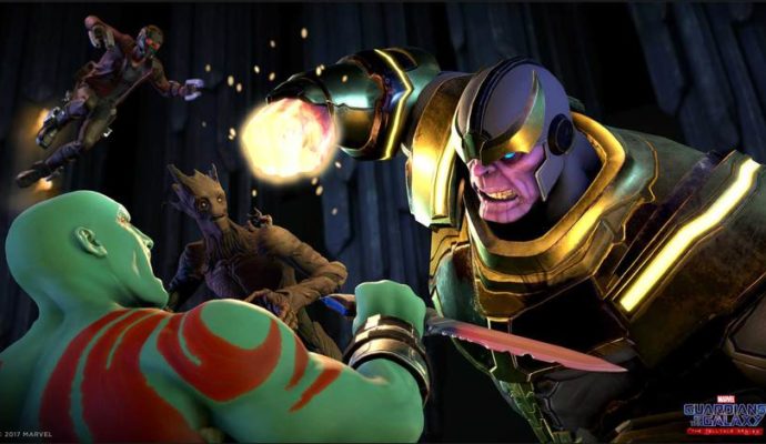 Thanos et Drax le destructeur se battent, avec Star-Lord et Groot en fond