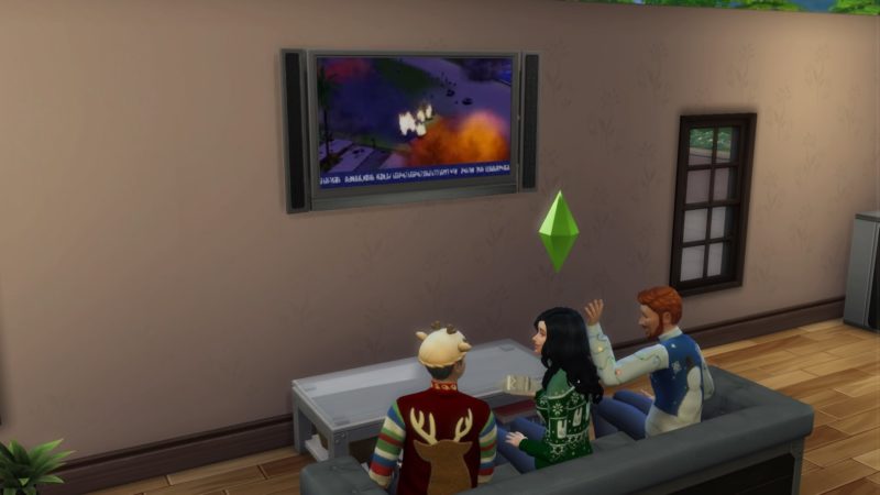 Les Sims 4 famille sur le canapé