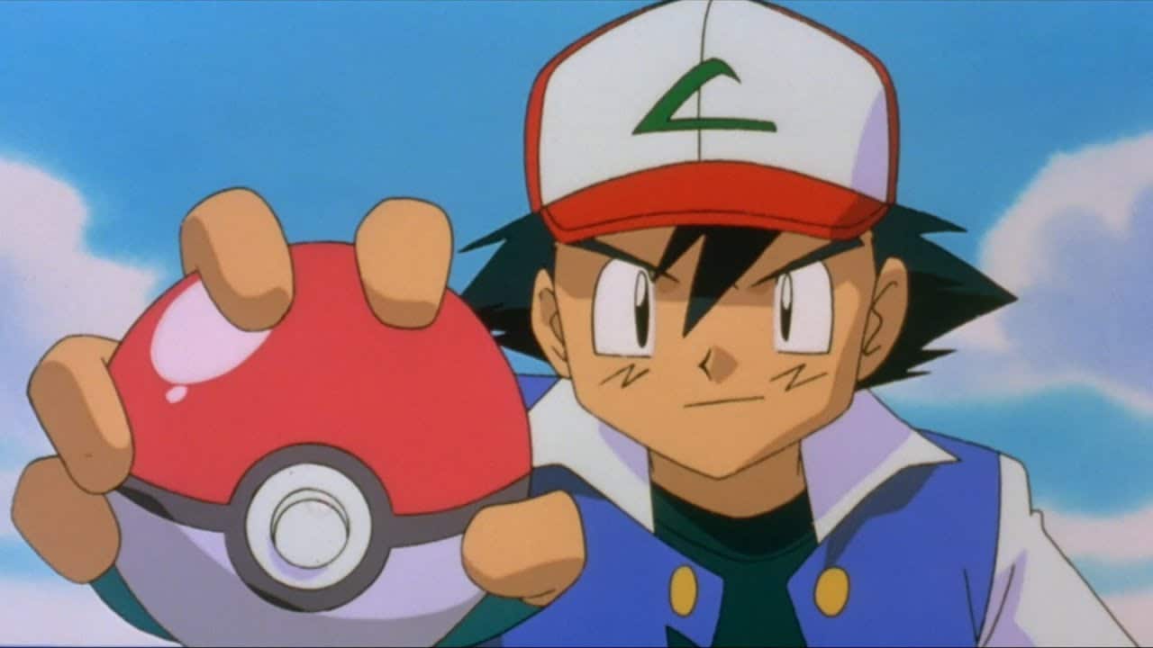 Sacha tient une pokéball dans sa main